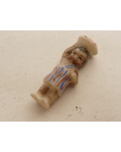 Ancienne fève en porcelaine 